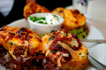 Loaded Baked Potatoes with Cheese, Salami and Salad