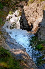 Breathtaking Waterfall Cascading Through Alpine Landscape