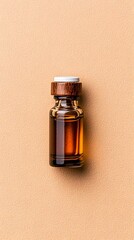 Amber Glass Vial of Essential Oil on Beige Corkboard