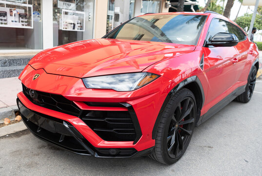 Miami, Florida, USA - December 15, 2024: red Lamborghini Urus 2022 crossover car. Luxury crossover car of Lamborghini Urus SUV type. Car of Lamborghini Urus parked outdoor. Lamborghini Urus, low view.
