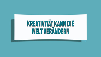 Kreativitaet kann die Welt veraendern (Creativity can change the world) - A card isolated on light green background.