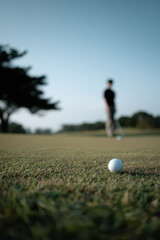 serene outdoor golf scene featuring minimalist design showcasing golfer in simple stance surrounded by lush green