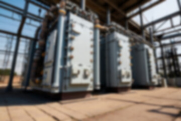 blurry electrical substation, large transformer as voltage regulator, there are many high voltage electrical panels