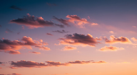 Fototapeta premium A Serene Sunset Sky with Soft Clouds and Warm Hues
