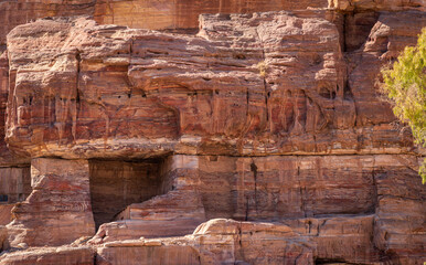 Unusual geology of a tomb in the wall near the Main Temple of Petra in Jordan