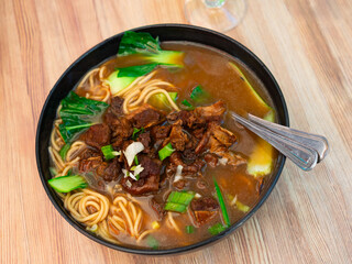 Beef soup with rich broth, spices and pepper. Hot Chinese noodle soup