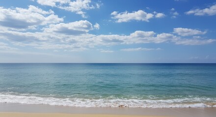 Ocean view representing serenity and peace, with blue sky and white clouds