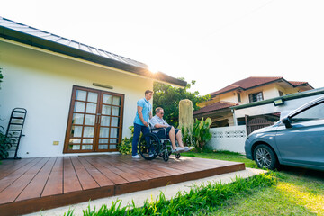 Male caregiver or taxi driver helping senior man patient on wheelchair get in the car go to hospital for medical appointments or healthcare therapy. Assisted elderly patient transportation services. © CandyRetriever 