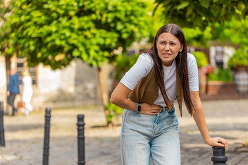 Caucasian young woman traveler feeling sudden strong abdominal stomach ache gastritis problem....