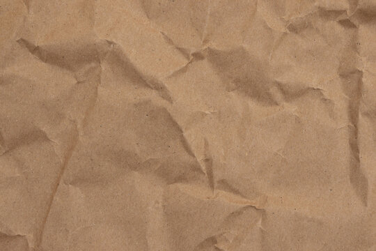 Crumpled brown butcher paper with wrinkled and textured background