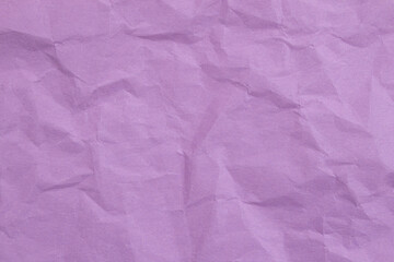 Crumpled purple paper with wrinkled and textured background