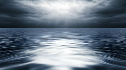 Obraz premium Vast ocean scene under stormy clouds with sunlight.