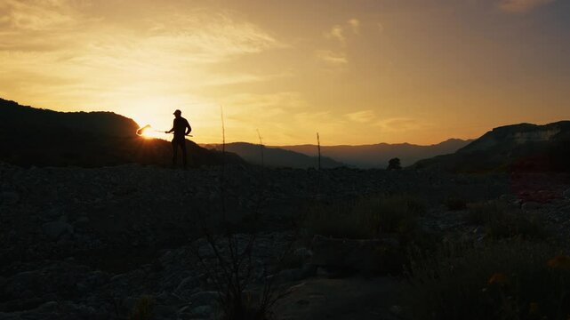 Silhouette Of A Sound Recordist With Boom Is Capturing Background Nature Sound