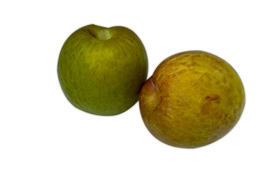 Two vibrant pluots, one green and one yellow, on white background.