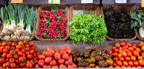 Bunch of different fresh vegetables on display at vegetable shop