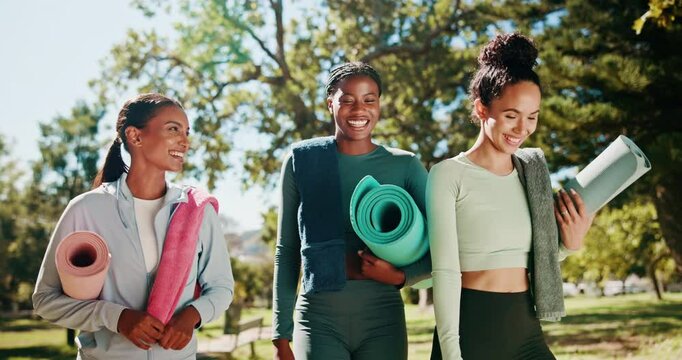 Fitness, women and walking with yoga mat at park for wellness exercise, workout tips and ready for class. Happy, friends and pilates equipment in nature for health routine, talking and start morning