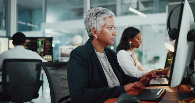 Thinking, woman and developer by computer in office of programming, it support and software update. Mature female person, pc or typing of website development, coding server and troubleshooting system