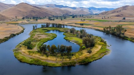 Obraz premium Scenic Mountain Landscape with River and Green Island in Nature