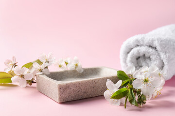 Spa composition with beautiful flowers on pink background, closeup. Space for text