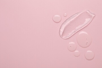 Collagen gel on pink background, top view. Space for text