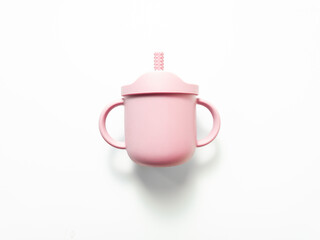 Top view of a pink baby sippy cup with straw spout and dual handles. Modern toddler drinking cup,...