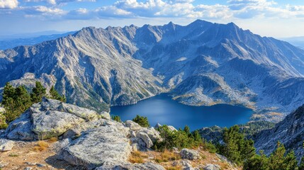 Majestic mountain range overlooking a serene alpine lake
