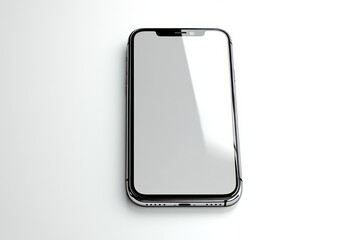 Modern smartphone with reflective screen lying face up on a clean white surface, showcasing sleek design and smooth edges