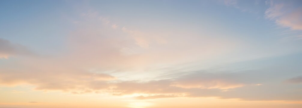 Pastel colored sky with clouds at sunrise or sunset soft and dreamy. - Powered by Adobe