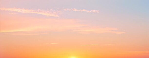 Obraz premium Sky with pastel colors light and soft clouds at sunrise or sunset.