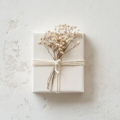 Simple white gift box adorned with dried flowers