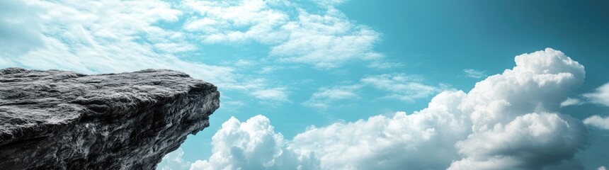 Obraz premium A breathtaking view of a rugged cliff under a dramatic sky filled with clouds. showcasing the beauty of nature and the tranquility of the landscape