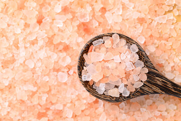 Organic Himalayan pink salt in wooden spoon, Healthy food ingredient