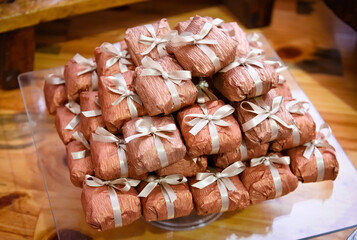 Delicious dulce de leche sweet called in portuguese: DOCE BEM CASADO, wrapped, sweets for weddings. Sweet happily married