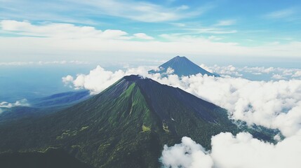 Fototapeta premium Majestic Costa Rican volcano rises above lush tropical greenery under clear blue sky and fluffy clouds, showcasing the natural beauty, environmental significance, and silhouette of Chato Mountain.