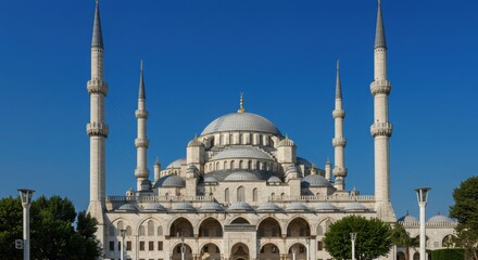 Naklejka premium Mosque architecture with minarets and blue sky