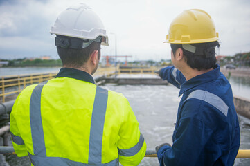 A professional engineer and technician are working together to seriously check the water quality in...