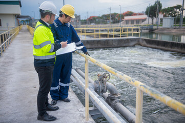 A professional inspector and a water treatment plant engineer are working together to check whether...