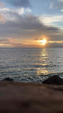 Sea with golden sun vertical video 4k