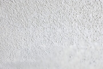 Obraz premium Textured wall in close-up: A detailed close-up showcases the texture and pattern of an abstract wall, evoking a sense of tactility and intricate design. 