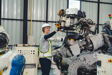 Technician Engineer in Factory, Maintaining and Repairing Robotic Arms Machinery, Ensuring Smooth...