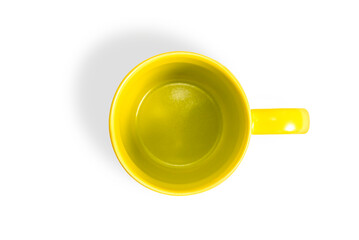 Empty yellow ceramic coffee cup isolated on white background.
