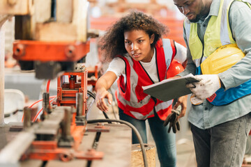 African American industrial experts inspection collaborate in factory, machinery technical planning, production management, teamwork strategies, workflow coordination, mechanical expertise innovation