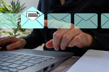 A woman with a computer points to an open email icon. Around it there are more email icons, but...