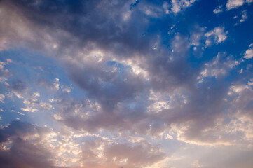 Dramatic sunset sky with clouds.