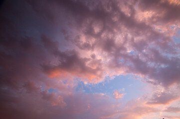 Dramatic sunset sky with clouds.