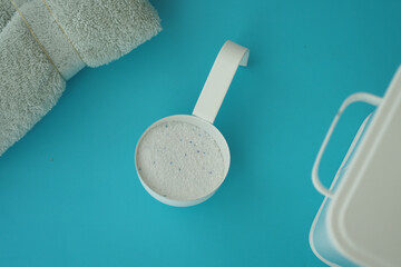 Laundry cup on blue surface