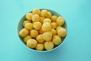 Delicious crunchy snack balls in a blue bowl