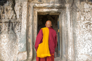 Buddhist monk visit to the Aurangabad Caves, India.