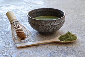 Matcha Tea Preparation: Bowl, Whisk, and Powder