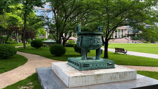 Memorial bronze tripod, donated by alumni association in 2005 to celebrate 100th anniversary of University on Handan Campus of Fudan University, Shanghai, China.
